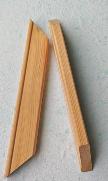 Close-up comparison of a 45-degree miter joint and a tenoned interlocking stretcher bar corner